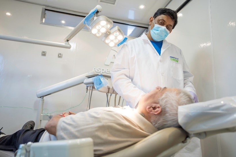 Aspen Dental Dentist cares for elderly patient